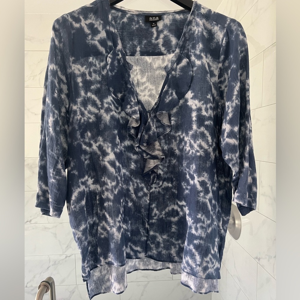 Blue & white tie-died shirt.